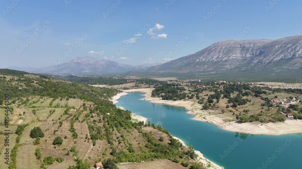 Drone view of the river and mountains in the distance - horizontal view to the right Drone view of the river and mountains in the distance - horizontal view to the right