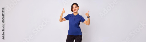 A portrait of a Southeast Asian woman wearing a navy polo shirt and giving a thumbs up.