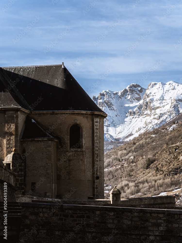 Fototapeta premium Historic buildings in Briançon with mountain fortress view