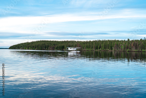 plane on the lake taking off and landing
