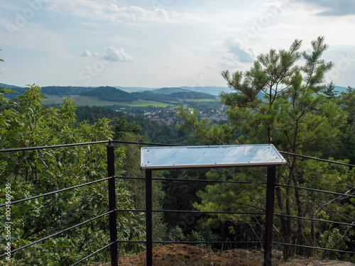 Panoramic view from sandstone rock viewpoint Ponorka, submarine at the top of 3 sandstone towers near Ceska Kamenice town. Summer landscape in Lusatian Mountains, green hills,oak and pine tree forest. photo