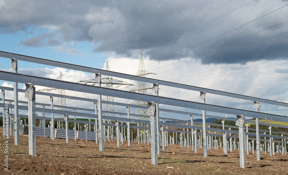 Fototapeta premium Construction site for solar panel system, transformation to renewable sustainable energy, environmental conversation