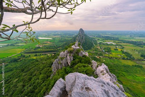 A mountain range with a lush green valley below Khao Nor - Khao Kheaw , Nakornsawan, thailand photo