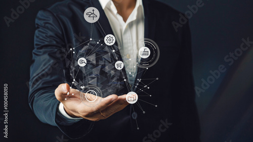 A businessman holds a transparent digital orb, visualizing a network of global connections and data points, emphasizing the role of advanced technologies in worldwide communication and information man