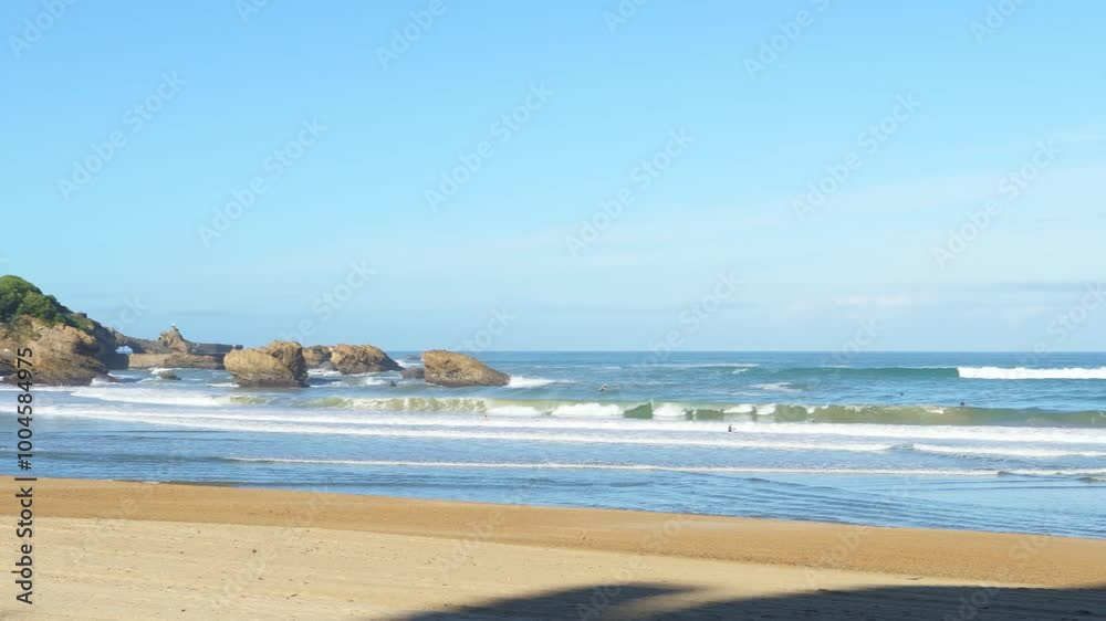 Crashing waves and surfers, Biarritz, France Crashing waves and surfers, Biarritz, France