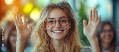 Smiling businesswoman holding smartphone, sitting in office, working on computer