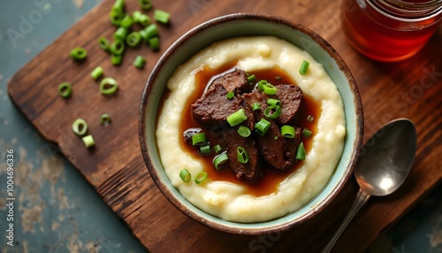 Grillades and Grits Topped with Tender Meat and Green Onions (Creole Cuisine) photo