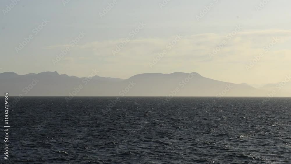 View from ferry at sunrise of the British Columbia coastal mountains View from ferry at sunrise of the British Columbia coastal mountains