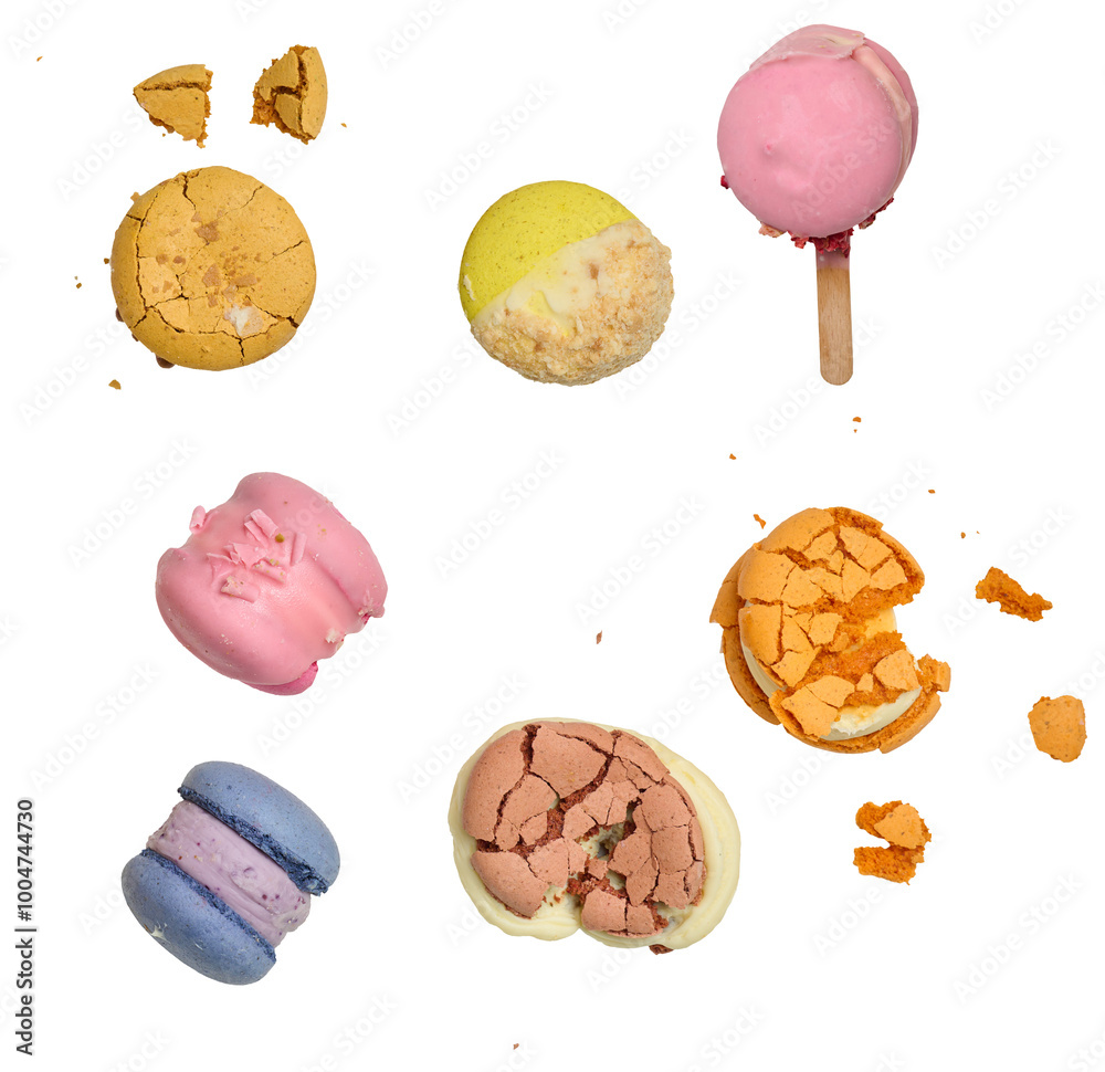 Broken round macarons with crumbs on a white background, delicious dessert Broken round macarons with crumbs on a white background, delicious dessert