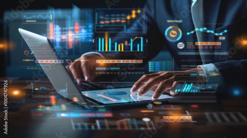 Businessman using a laptop and tablet to show financial data, stock market graphs and charts with a business growth concept