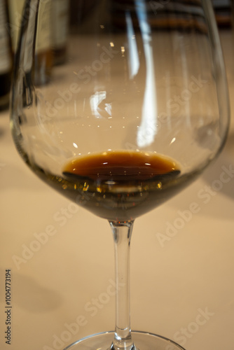 Tasting of sweet Bordeaux white wine in Sauternes, left bank of Gironde Estuary, France. Glasses of white sweet French wine served in restaurant photo