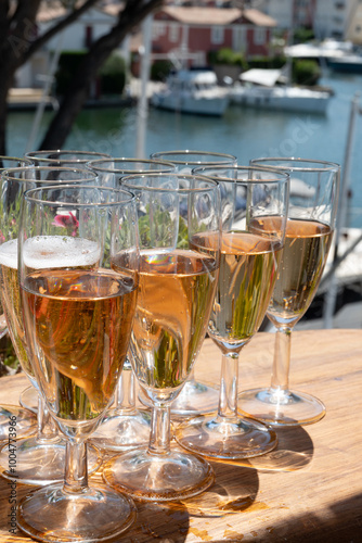 Summer party, French brut rose champagne sparkling wine in flute glasses in yacht harbour of Port Grimaud near Saint-Tropez, French Riviera vacation, Var, France