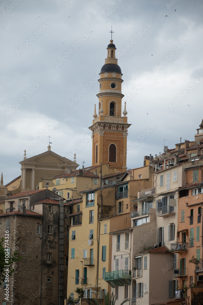 Fototapeta premium View on French Riviera, colorful Menton old city and marina on blue Mediterranean Sea near French-Italian border, travel destination, panoramic view from above