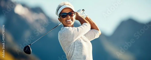 Senior female golfer with impeccable form, embodying years of refined technique, scenic mountain backdrop