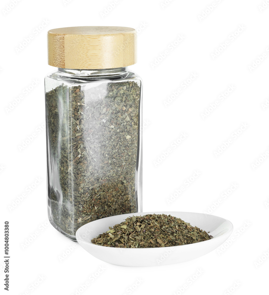 Dry basil in glass jar isolated on white