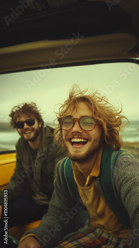 Obraz na płótnie a group of cool hipster friends traveling in a yellow car along the coast, embracing a traveler lifestyle and sustainable tourism w salonie