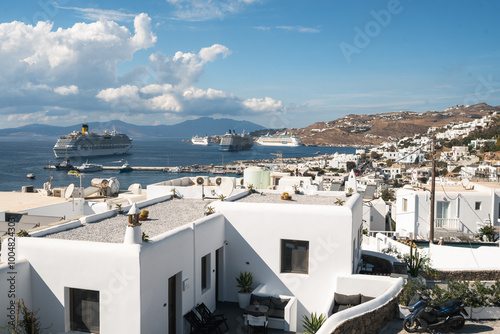 Beautiful Coastal Cityscape View of Mykonos in Greece with Blue Skies, White Buildings and the Sea