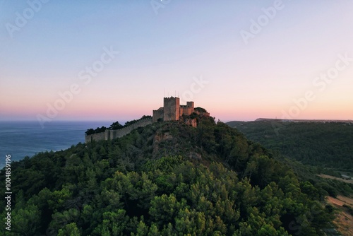 Tableau sur toile Portugal medieval castle at sunset