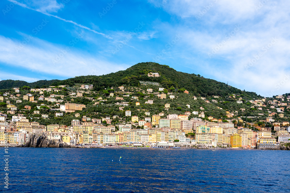 Colorful buildings and beach at Camogli on sunny summer day, Liguria, Italy