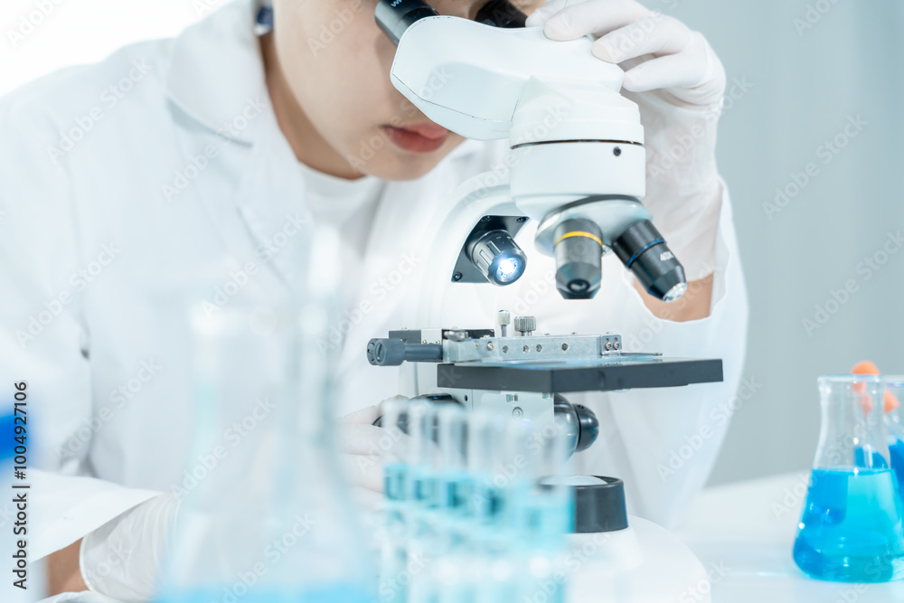 Scientist analyze biochemical samples in advanced scientific laboratory. Medical professional use microscope look microbiological developmental of viral. Biotechnology research in science lab... Scientist analyze biochemical samples in advanced scientific laboratory. Medical professional use microscope look microbiological developmental of viral. Biotechnology research in science lab...