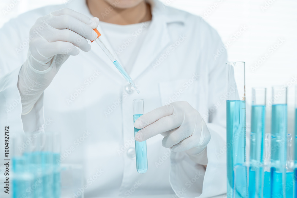 Scientist analyze biochemical samples in advanced scientific laboratory. Medical professional use dropper mix microbiological developmental of viral. Biotechnology research in science lab. cosmetic Scientist analyze biochemical samples in advanced scientific laboratory. Medical professional use dropper mix microbiological developmental of viral. Biotechnology research in science lab. cosmetic