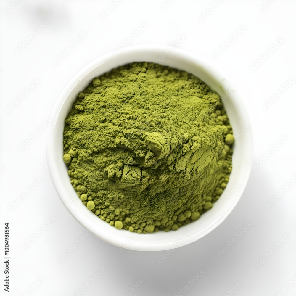 Top view of green powder in a white bowl Top view of green powder in a white bowl