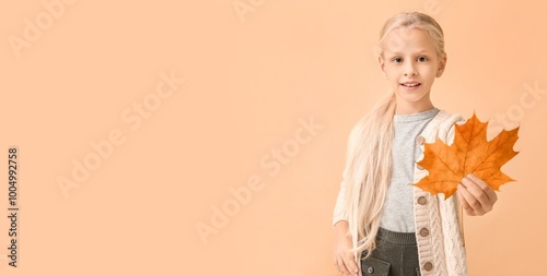 Cute little girl holding au...