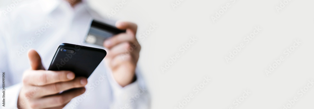 Man with smartphone and credit card Man with smartphone and credit card