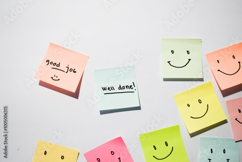 Good Job and well done with smile emoticon on sticky notes. Motivational words for personal development, inspirational handwriting. Isolated on background