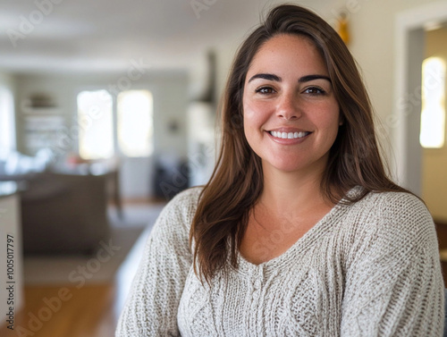 confident, overweight 35 year old brunette woman in an open layout home. she has a confident look. she is nicely dressed in jeans and a solid sweater. her hair is straight and down.