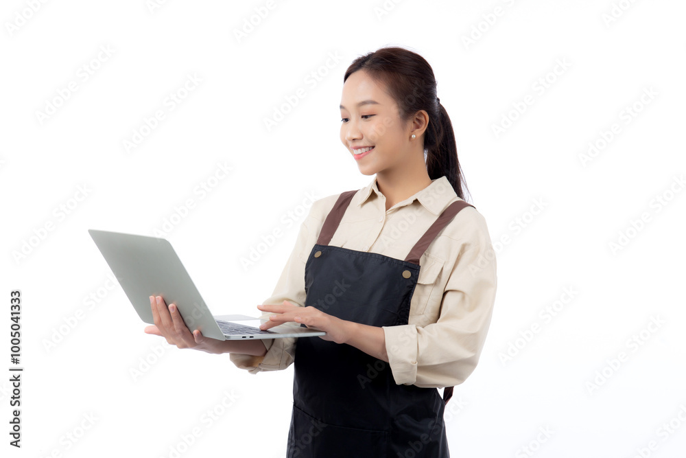 Portrait young asian business woman wearing apron holding laptop computer isolated white background, waitress or barista holding laptop computer with confident, cut out, business or freelance. Portrait young asian business woman wearing apron holding laptop computer isolated white background, waitress or barista holding laptop computer with confident, cut out, business or freelance.