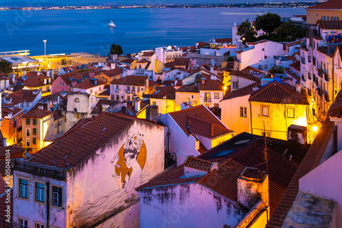 Twilight view of Alfama, one of Lisbon’s oldest areas with shops selling traditional crafts and cafes, Portugal