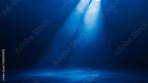 blue spotlight on stage creating dramatic atmosphere
