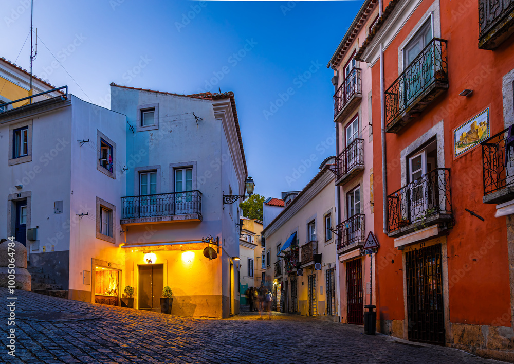 Twilight view of Alfama, one of Lisbon’s oldest areas with shops selling traditional crafts and cafes, Portugal
