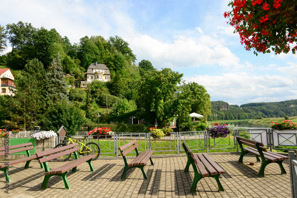 Obraz premium View of park with benches in village