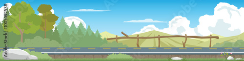 A scenic of asphalt road stretches through a lush green forest. Mountains rise in the distance, and a wooden fence lines the side of the road. The sky is blue with fluffy white clouds.