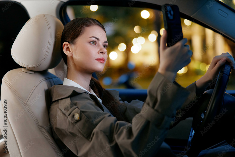 Woman in car taking selfie a woman sits in the driver's seat of a car ...
