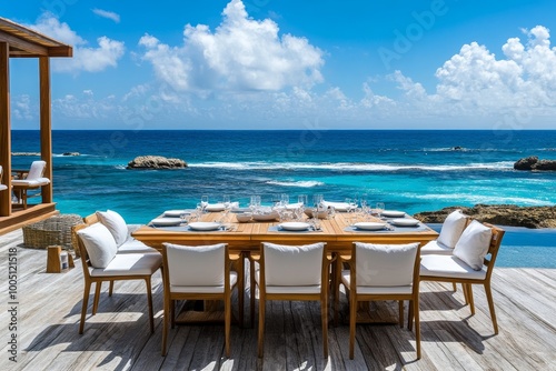 Stylish dining space with modern wooden furniture and white cushions by the serene blue ocean shore