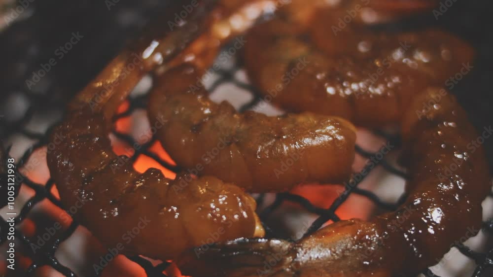 Grilled shrimp that's being cooked with smoke on the grill. Grilled shrimp that's being cooked with smoke on the grill.