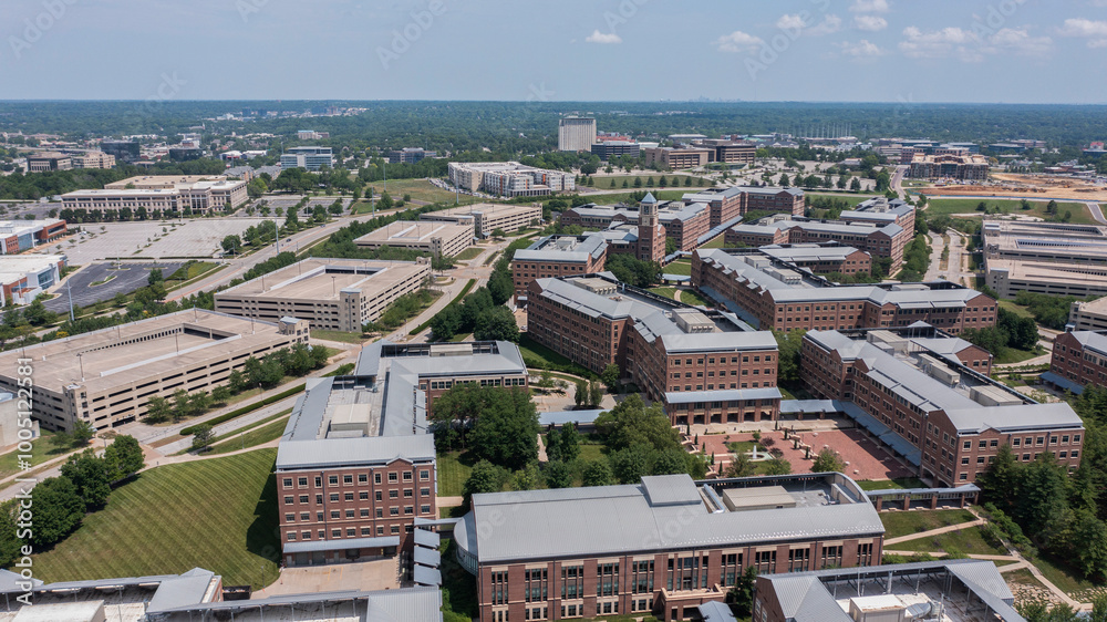 Fototapeta premium Overland Park, Kansas, USA - June 17, 2023: Morning light shines on the buildings of the downtown city skyline.