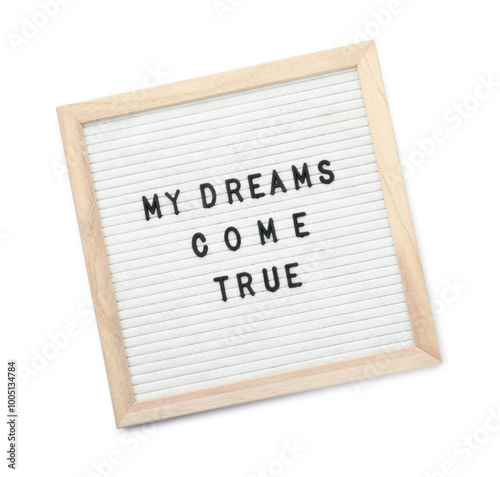 Letter board with phrase My dreams come true on white background, top view