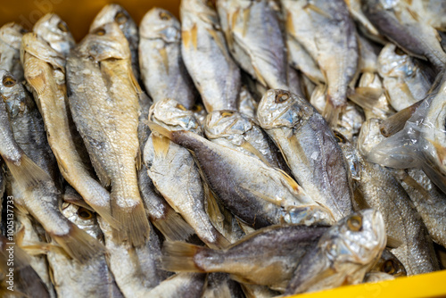 This image offers a fascinating glimpse into the world of preserved seafood, showcasing a diverse array of dried fish and other marine delicacies. 