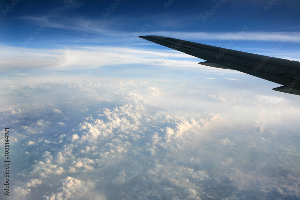 Fototapeta premium airplane wing and cloud during the flight