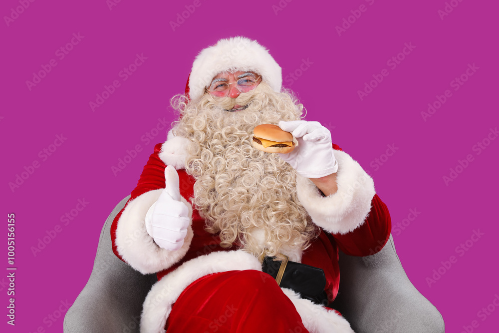Santa Claus with tasty burger showing thumb-up on purple background Santa Claus with tasty burger showing thumb-up on purple background