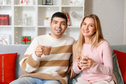 Young couple with cocoa at ...