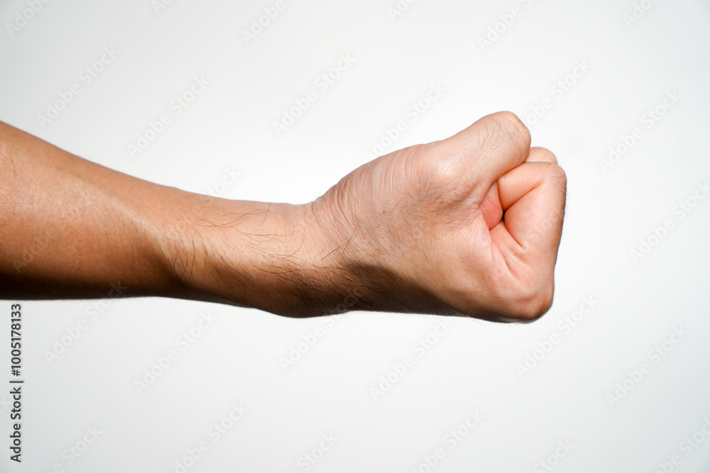 Male hands showing clenched fist action on white background. Including the route cut. Male hands showing clenched fist action on white background. Including the route cut.