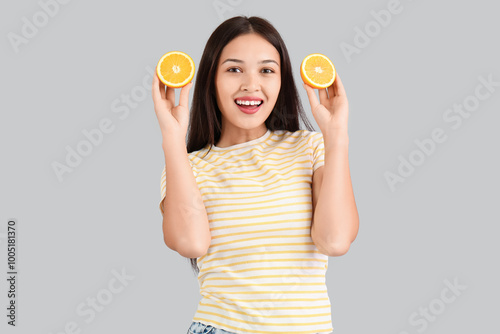 Happy young woman holding t...
