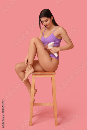 Young woman in underwear us...