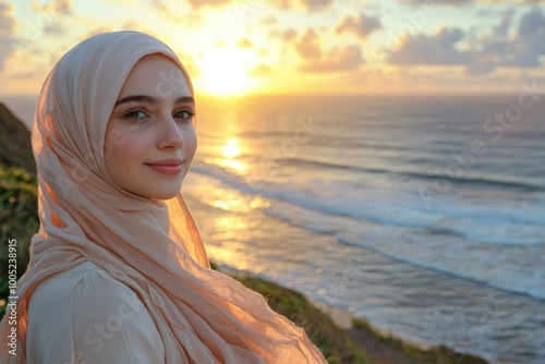 Woman in a Hijab Gazes at the Ocean During Sunset