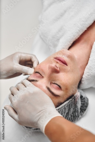 Relaxing facial treatment at a spa with a client receiving care